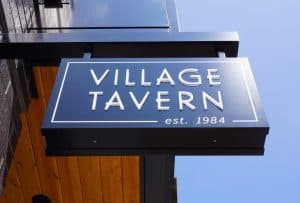 village tavern blade sign